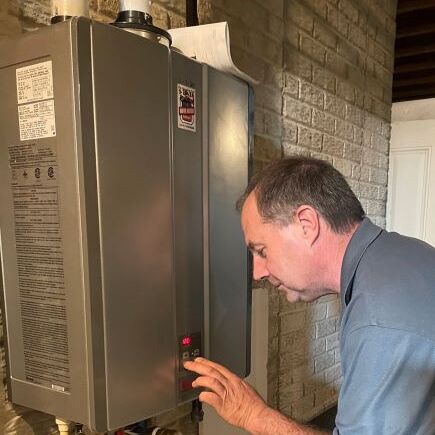 A Technician Checks a Tankless Water Heater.
